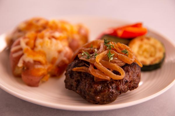 Beef Cheddar Burger topped with Caramelized Onions