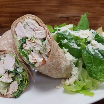 Chicken Caesar Wrap with Romaine Lettuce, Caesar Dressing and Parmesan Cheese served with Mixed Greens Salad with Balsamic Vinaigrette