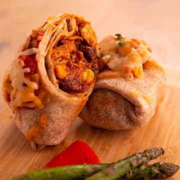 Chicken Enchiladas served with Corn, Beans, Tomato Salsa and Cheese with Seasonal Vegetables