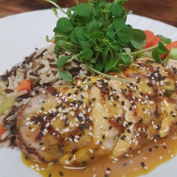 Grilled Chicken in a Sesame Orange Sauce served over a Wild and Brown Rice Pilaf with Seasonal Vegetables