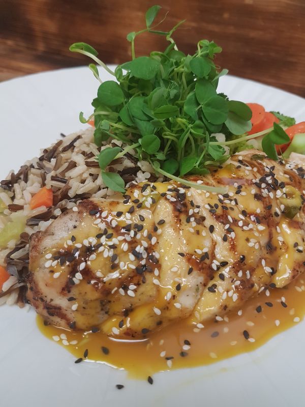 Grilled Chicken in a Sesame Orange Sauce served over a Wild and Brown Rice Pilaf with Seasonal Vegetables