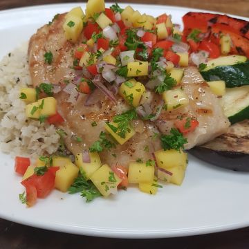 Grilled White Fish with Mango Salsa served on Carrot Rice with Grilled Vegetables