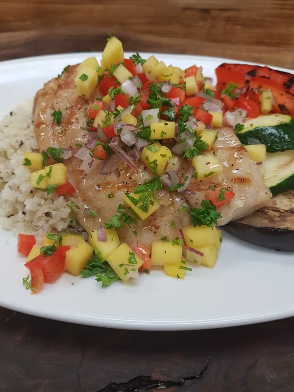 Grilled White Fish with Mango Salsa served on Carrot Rice with Grilled Vegetables