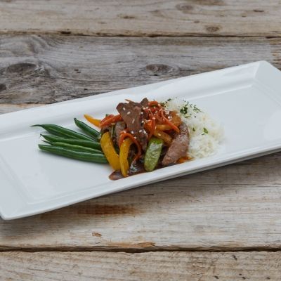 Orange Beef Stir-fry served with Bell Peppers, Snow Peas and Water Chestnuts over Basmati Rice