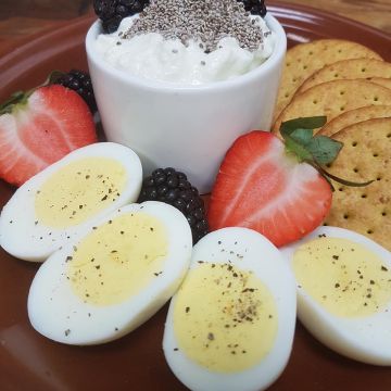 Protein Power Breakfast includes Hard-Boiled Egg, Creamy Cottage Cheese, topped with Chia Seeds and Seasonal Fruit and Berries