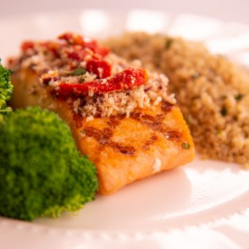 Salmon with Sundried Tomato and Olive Crust served with Herbed Quinoa and Broccoli