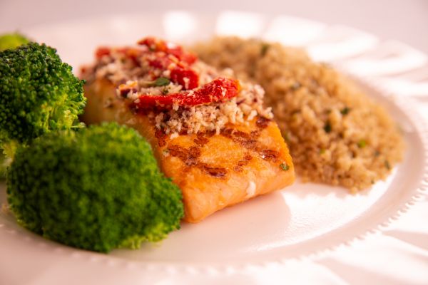 Salmon with Sundried Tomato and Olive Crust served with Herbed Quinoa and Broccoli